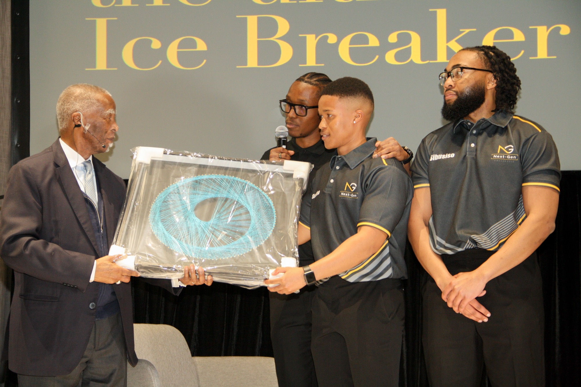 The collective presenting a gift to His Excellency Thabo Mbeki