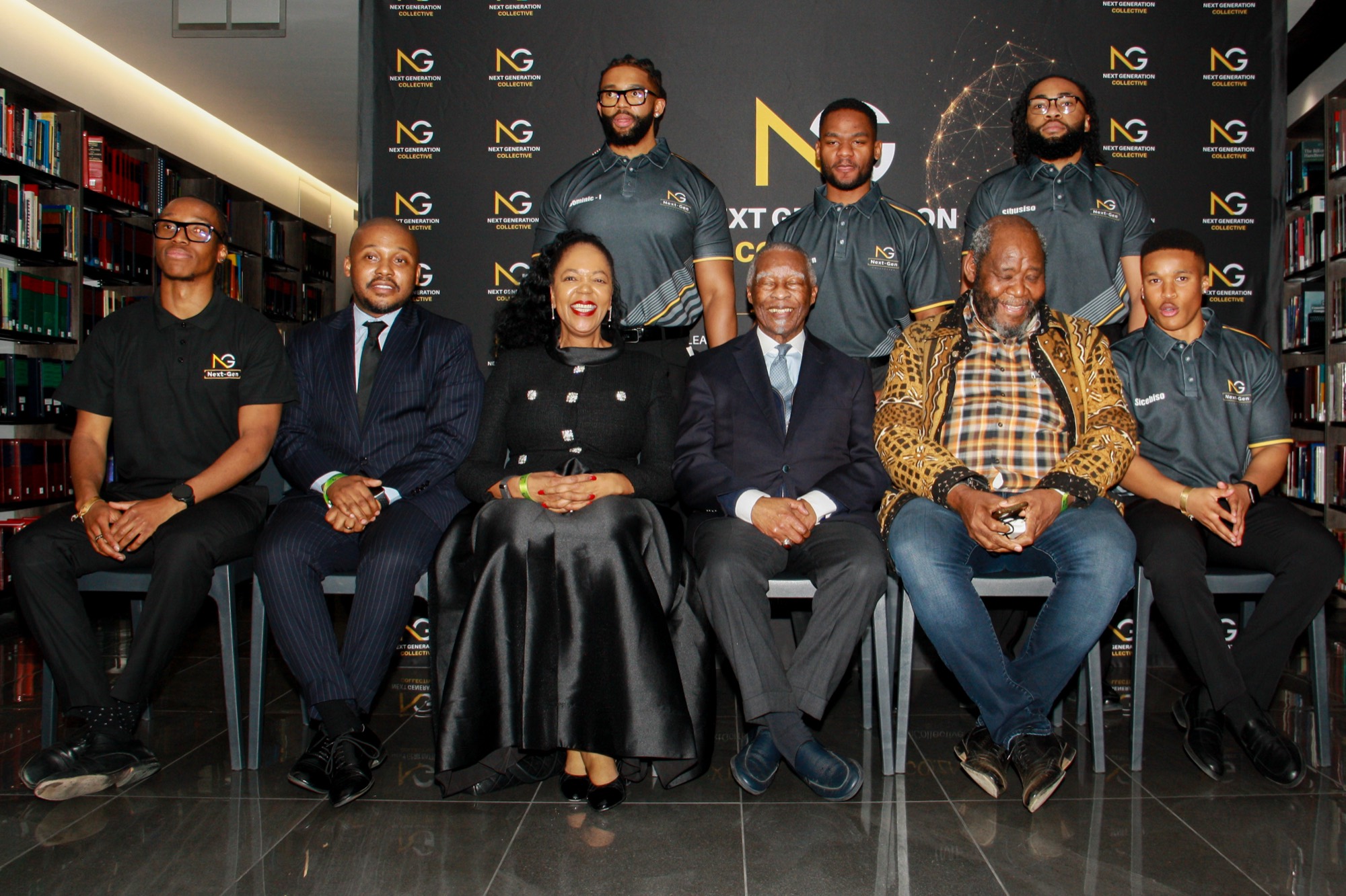 Dignitaries and the collective standing together for a group portrait