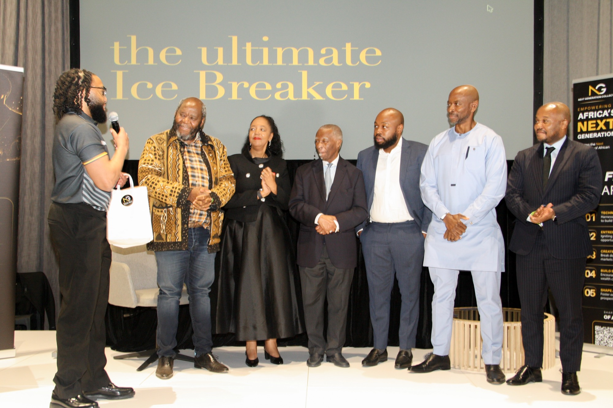 Full panel of speakers and guests on stage